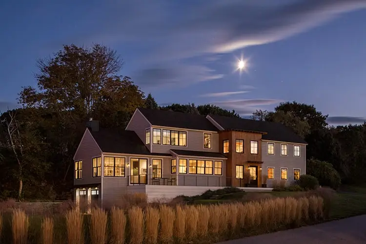 Contemporary ocean-view home lit at night – Contemporary on the Cape project, Cape Elizabeth, Maine
