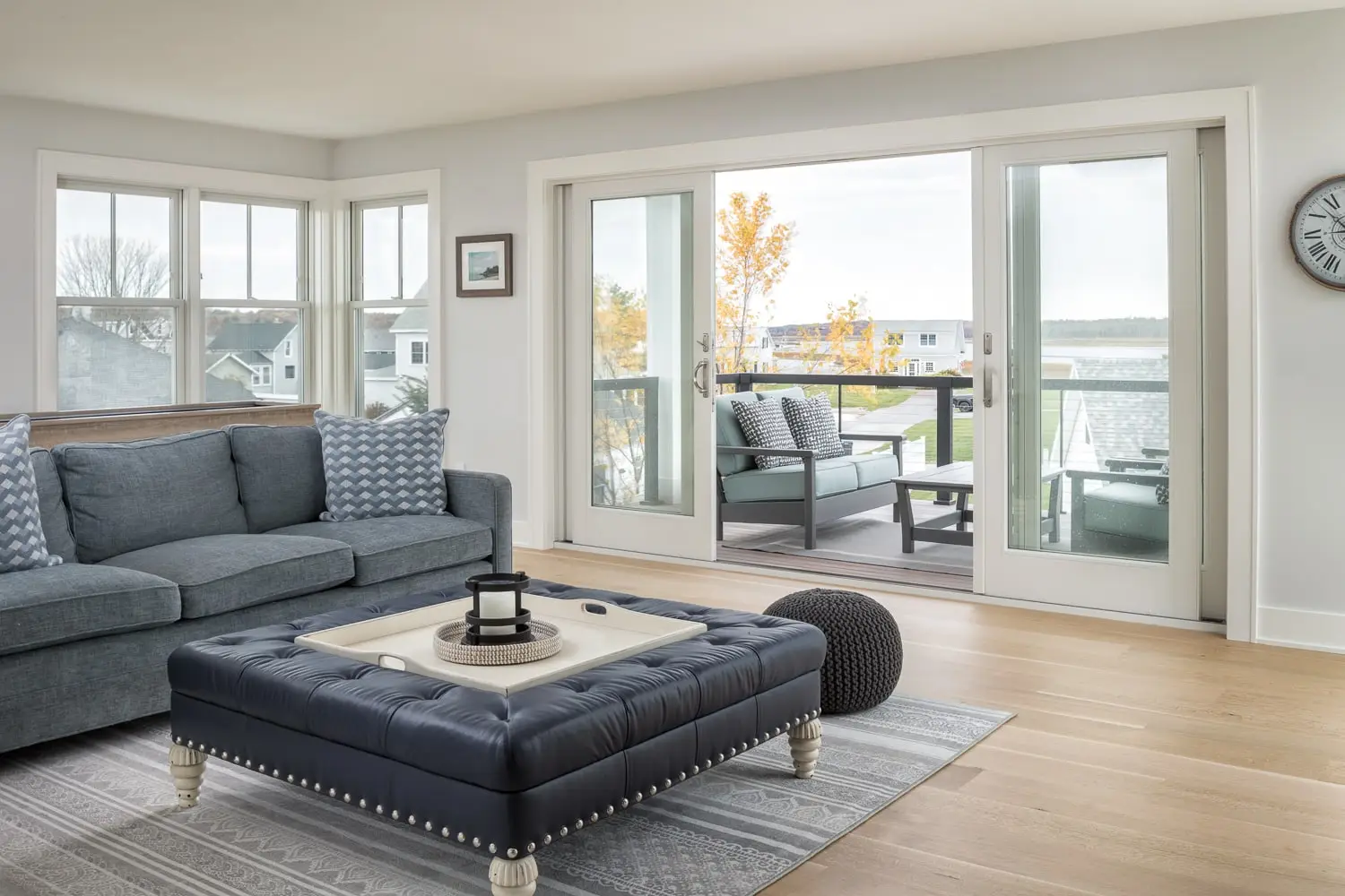 Open-concept living area after a layout renovation at Pine Point, Maine