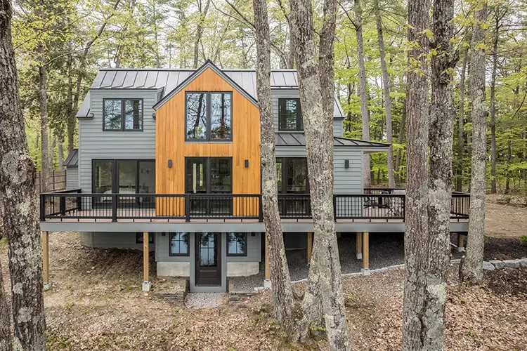 Renovated lake house with cedar gable and half-wrap deck among pines – Lake House project, Windham, Maine
