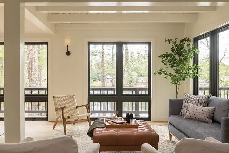 Living room with floor-to-ceiling lake-view windows – Lake House project, Windham, Maine