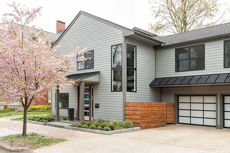 Entry with pink door and cherry blossoms – Vaughan Street renovation, Portland, Maine