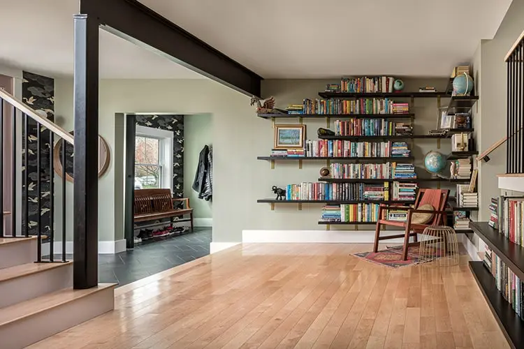 Library wall with open bookshelves – Vaughan Street renovation, Portland, Maine