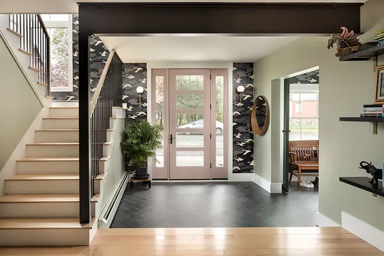 Entry hall with slate floor and wallpapered staircase – Vaughan Street renovation, West End, Portland, Maine