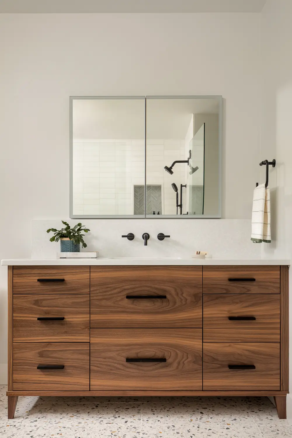 Modern kitchen with walnut cabinetry and island – Whites Cove net-zero home, Yarmouth, Maine