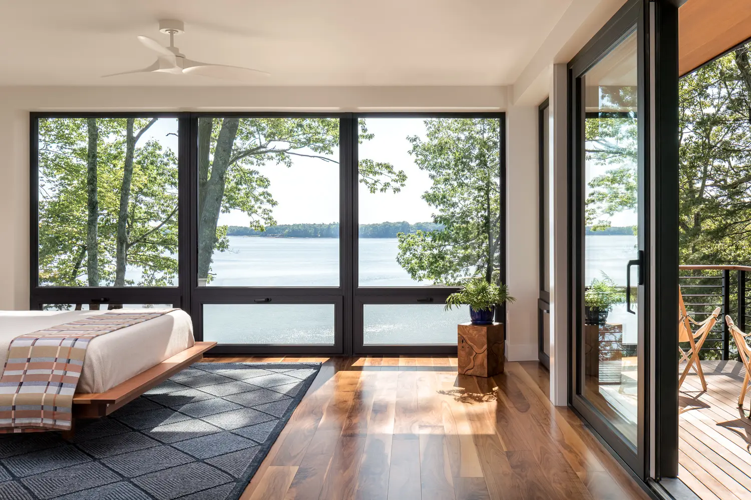 Primary bedroom with floor-to-ceiling ocean views – Whites Cove net-zero home, Yarmouth, Maine