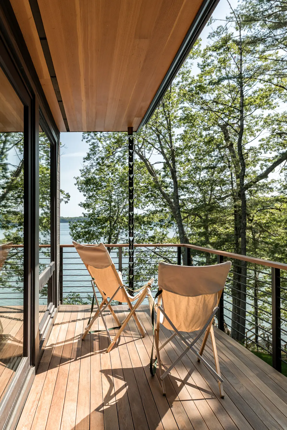 Covered balcony overlooking the water – Whites Cove net-zero home, Yarmouth, Maine